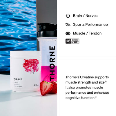 Thorne Creatine Strawberry Flavored tub with shaker bottle and fresh strawberries on a bright lifestyle background
