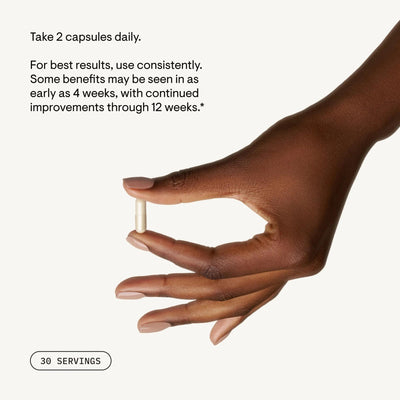 Hand holding a single Thorne Radiant Skin Complex capsule with dosage text and “30 servings” note on a light background