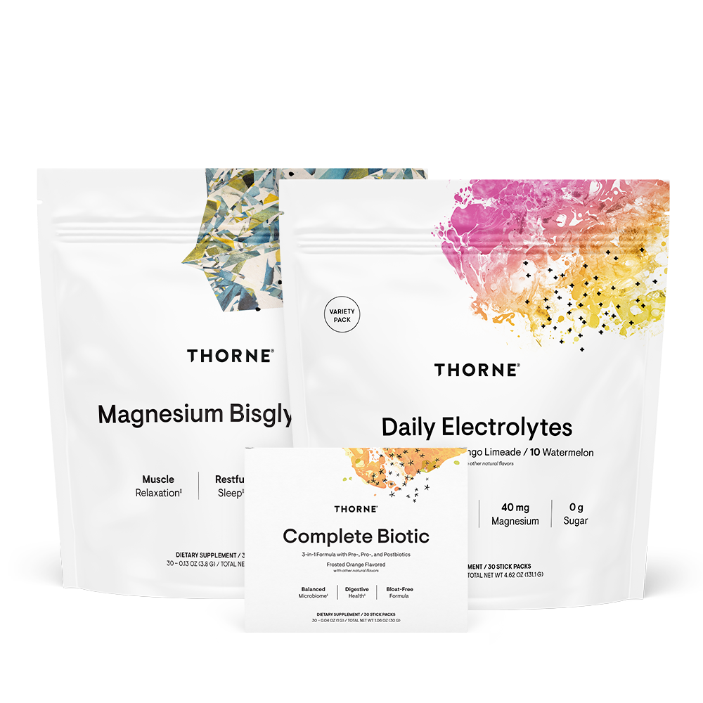 Thorne Travel Stack featuring Magnesium Bisglycinate, Daily Electrolytes, and Complete Biotic supplement pouches and box front