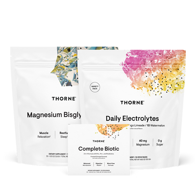 Thorne Travel Stack featuring Magnesium Bisglycinate, Daily Electrolytes, and Complete Biotic supplement pouches and box front