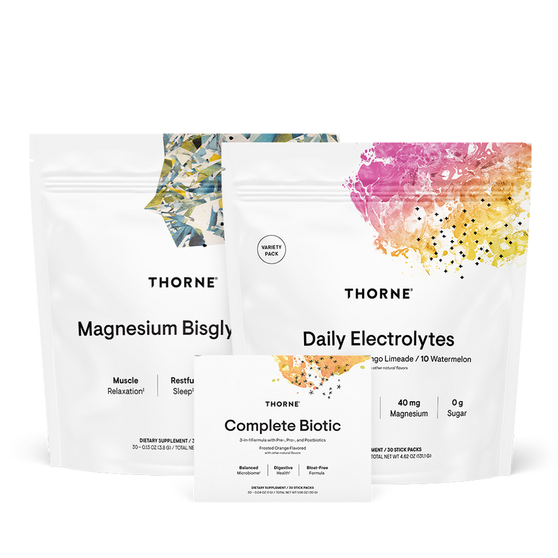 Thorne Travel Stack featuring Magnesium Bisglycinate, Daily Electrolytes, and Complete Biotic supplement pouches and box front