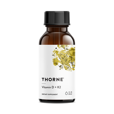 Thorne Vitamin D K2 Liquid 1200 Drops in an amber bottle with white label and yellow abstract design, front view