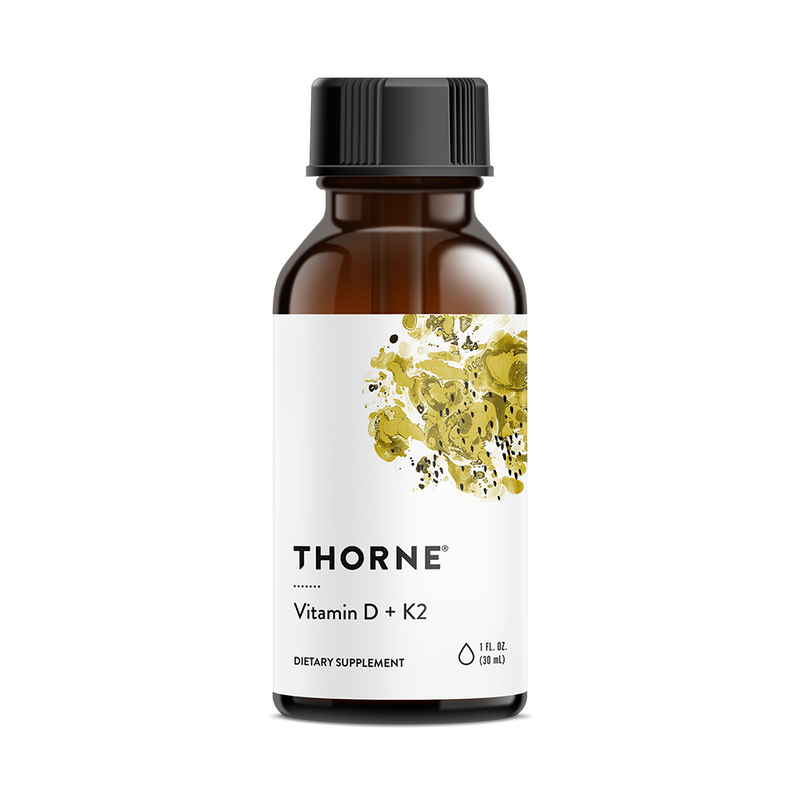 Thorne Vitamin D K2 Liquid 1200 Drops in an amber bottle with white label and yellow abstract design, front view